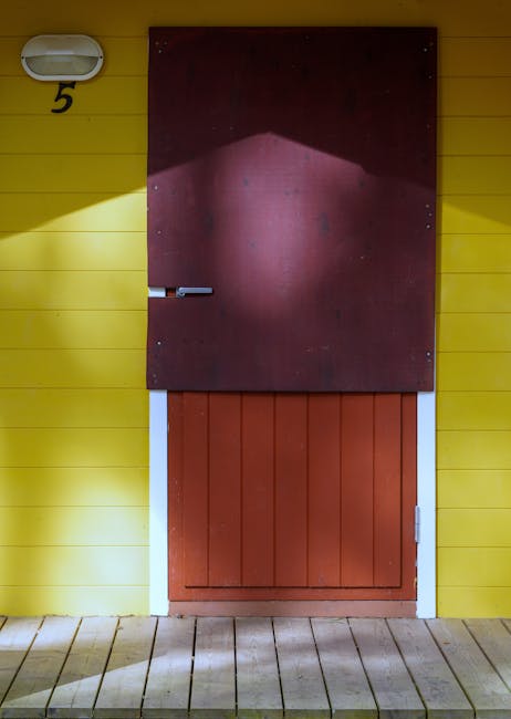 Yellow building wall with number 5 door